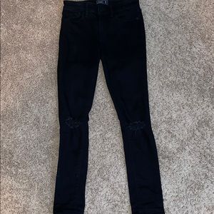 Black Abercrombie and Fitch jeans with 2 rips